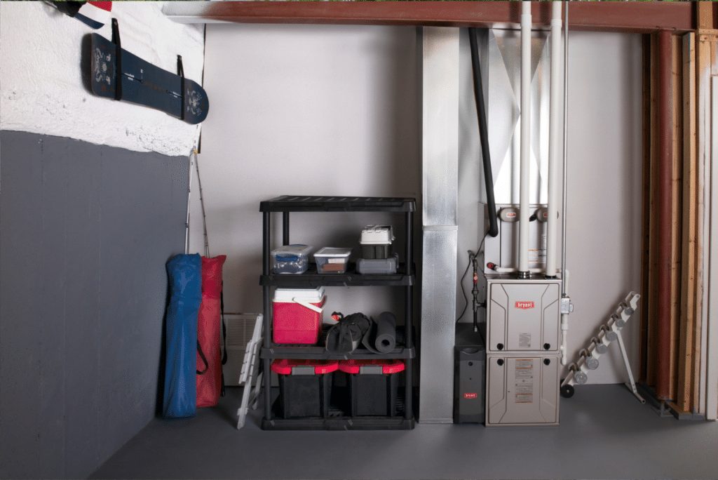 Clean modern high-efficiency gas furnace installed in a residential basement